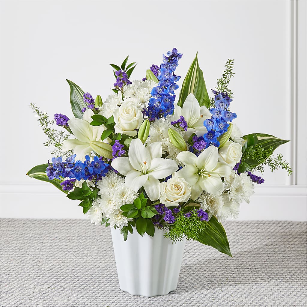 blue roses and white lilies bouquet Take Comfort Floor Basket – blue, white flower arrangement | Strongsville, OH